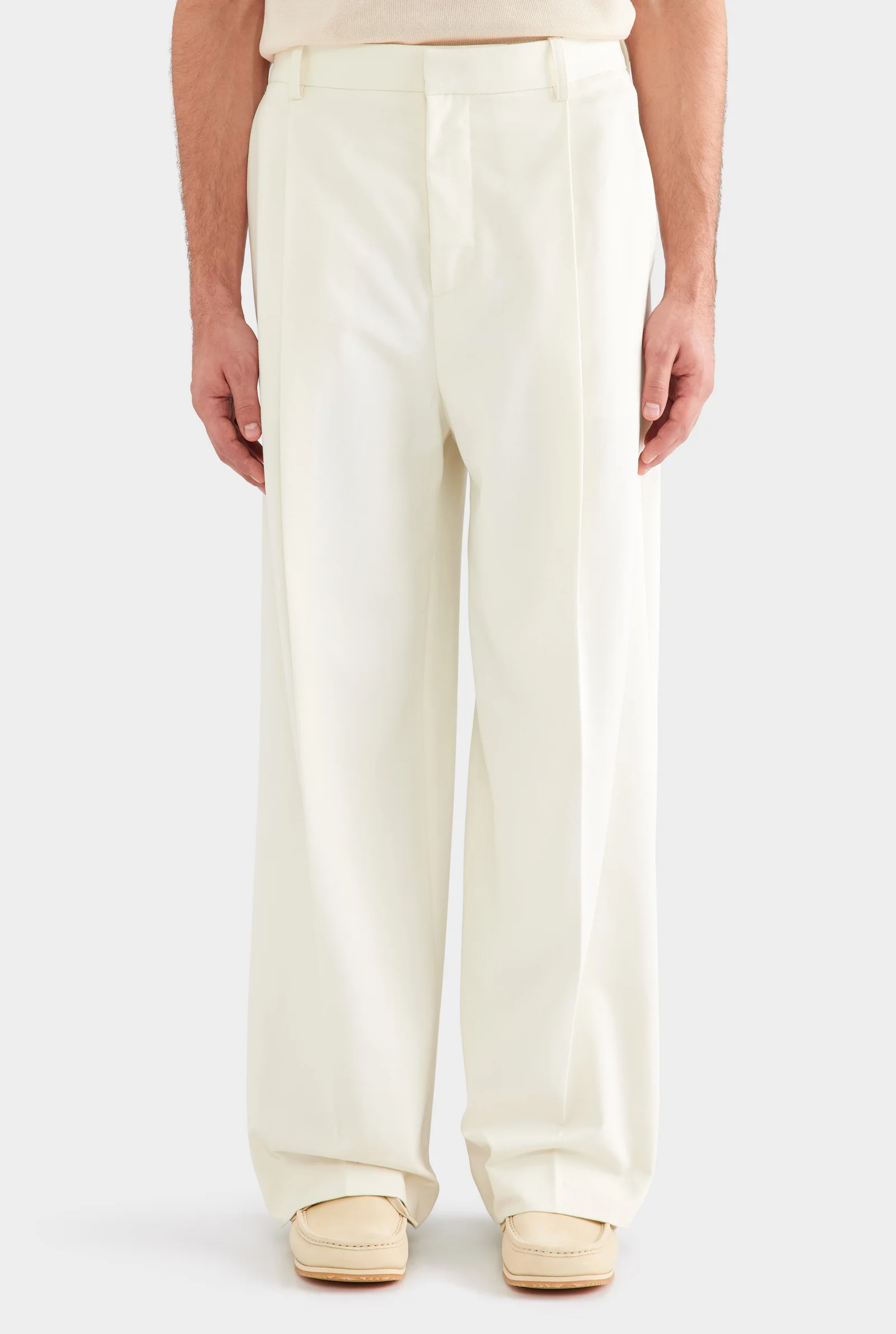Cream relaxed pleated trousers