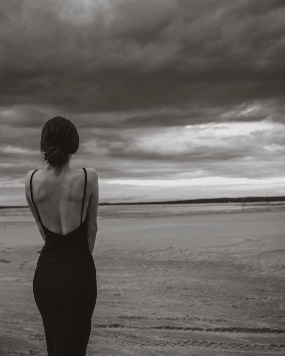 Black evening dress presented as a considered fashion selection